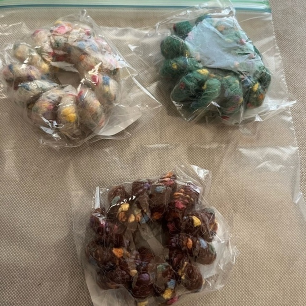NWT multi colored hair bands. In original packaging.